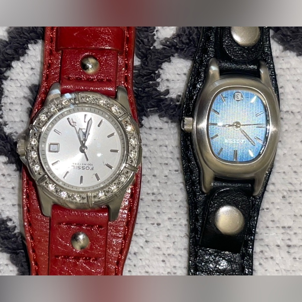 Fossil Black Leather Watch & a red leather Fossil watch. Both need batteries.
